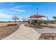 Modern playground with shade structure and benches at 31271 N 133Rd Dr, Peoria, AZ 85383