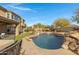 Luxury pool and spa with a rock waterfall and backyard access at 31271 N 133Rd Dr, Peoria, AZ 85383