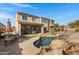 Inviting backyard oasis with a pool, spa, and patio at 31271 N 133Rd Dr, Peoria, AZ 85383