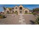 Front view of two story home with stone accents and landscaping at 3770 E Graythorn Way, Coolidge, AZ 85128