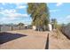 Spacious backyard with a large tree and a partially visible patio at 403 W Roosevelt Ave, Coolidge, AZ 85128