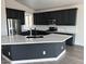 Modern kitchen with dark cabinetry and expansive island at 4047 E Pullman Rd, Cave Creek, AZ 85331