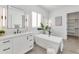 Spa-like bathroom with a freestanding tub and walk-in shower at 4511 N 38Th Pl, Phoenix, AZ 85018