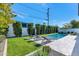 Inviting pool area with lounge chairs and ample lawn space at 4511 N 38Th Pl, Phoenix, AZ 85018