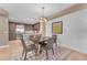 Elegant dining area with modern light fixture at 4805 N Woodmere Fairway -- # 1003, Scottsdale, AZ 85251