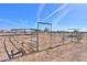 Multiple horse stalls and a gate at 53129 W Badger Rd, Maricopa, AZ 85139