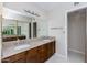 Bathroom boasts double sinks, granite countertops, and wood cabinets at 5909 E Crocus Dr, Scottsdale, AZ 85254