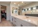 Modern bathroom with double vanity, large mirror, and walk-in shower at 6807 W Winston Dr, Laveen, AZ 85339