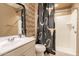 Clean bathroom with shower and patterned curtain at 6807 W Winston Dr, Laveen, AZ 85339
