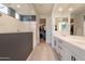 Elegant bathroom with double sinks, walk-in shower, and access to closet at 6807 W Winston Dr, Laveen, AZ 85339