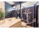 Nautical-themed bathroom with shower, toilet and single vanity at 6807 W Winston Dr, Laveen, AZ 85339