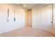 Charming bedroom with light walls and sliding closet doors at 6807 W Winston Dr, Laveen, AZ 85339