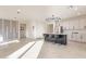Modern kitchen with white shaker cabinets, quartz countertops and large island at 6807 W Winston Dr, Laveen, AZ 85339