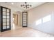 Office with wood floors and glass doors at 6807 W Winston Dr, Laveen, AZ 85339