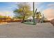 Home with a kidney-shaped pool, artificial turf, and a wooden fence at 7918 E Dale Ln, Scottsdale, AZ 85266