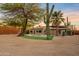 Home with a kidney-shaped pool, artificial turf, and a wooden fence at 7918 E Dale Ln, Scottsdale, AZ 85266