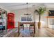 Charming dining area with a wooden table, chairs, and a unique telephone booth at 7918 E Dale Ln, Scottsdale, AZ 85266