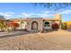 Ranch-style home with red flowers and a desert setting at 7918 E Dale Ln, Scottsdale, AZ 85266