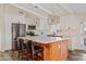 Modern kitchen with white cabinets, quartz countertops, and stainless steel appliances at 7918 E Dale Ln, Scottsdale, AZ 85266