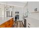 Modern kitchen with white cabinets, quartz countertops and stainless steel appliances at 7918 E Dale Ln, Scottsdale, AZ 85266