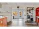 Modern kitchen with white cabinets and an orange island, leading to a sunroom at 7918 E Dale Ln, Scottsdale, AZ 85266
