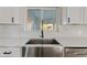 Farmhouse sink with a modern faucet and white subway tile backsplash at 7918 E Dale Ln, Scottsdale, AZ 85266