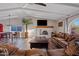 Bright living room with hardwood floors, fireplace, and ample seating at 7918 E Dale Ln, Scottsdale, AZ 85266