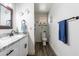 Bathroom featuring granite countertops, updated fixtures, and blue sea-themed decor at 8039 E Madero Ave, Mesa, AZ 85209