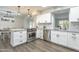 Open kitchen design with granite counters, stainless appliances, and connection to dining area at 8039 E Madero Ave, Mesa, AZ 85209