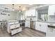 Open kitchen design with granite counters, stainless appliances, and connection to dining area at 8039 E Madero Ave, Mesa, AZ 85209