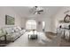 Bright living room featuring a large window, neutral tones, and comfortable seating at 8039 E Madero Ave, Mesa, AZ 85209