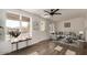 Inviting living room with backyard views, modern furniture, and a serene atmosphere at 8039 E Madero Ave, Mesa, AZ 85209