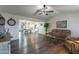 Spacious living room featuring hardwood floors, a cozy seating area, and an open floor plan at 8039 E Madero Ave, Mesa, AZ 85209