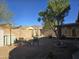 Small backyard with gravel, patio furniture, and a covered patio at 8944 E Red Mountain Ln, Gold Canyon, AZ 85118