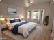 Bright bedroom features a large window, ceiling fan, and neutral decor, creating a serene retreat at 8944 E Red Mountain Ln, Gold Canyon, AZ 85118