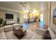 Spacious living room with an open concept to kitchen, modern furniture, and lots of natural light at 8944 E Red Mountain Ln, Gold Canyon, AZ 85118