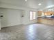 Bright living area with tiled floors and open access to the kitchen, with a neutral color palette to create a relaxing atmosphere at 8944 E Red Mountain Ln, Gold Canyon, AZ 85118
