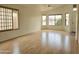 Bright living room with wood floors, modern windows, and neutral paint at 8944 E Red Mountain Ln, Gold Canyon, AZ 85118