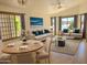 Inviting living room with ample seating, light hardwood floors and large windows, perfect for entertaining at 8944 E Red Mountain Ln, Gold Canyon, AZ 85118