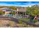 Home with a private pool and putting green, surrounded by lush landscaping at 9422 N Sunset Rdg, Fountain Hills, AZ 85268