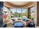 Relaxing sitting area with curved sofa and mountain views at 9422 N Sunset Rdg, Fountain Hills, AZ 85268