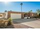 Ranch style home with a two-car garage and desert landscaping at 9507 W Burns Dr, Sun City, AZ 85351