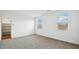 Bright bedroom with neutral carpeting and large windows at 9868 S Caballo Dr, Apache Junction, AZ 85120
