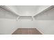 Large walk-in closet with double hanging rods and shelving at 9868 S Caballo Dr, Apache Junction, AZ 85120