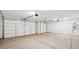 Two-car garage with white walls and polished concrete floor at 9868 S Caballo Dr, Apache Junction, AZ 85120