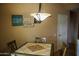 Breakfast nook with tile-top table and chairs near kitchen at 10105 E Meandering Trail Ln, Gold Canyon, AZ 85118