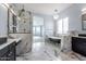 Elegant bathroom with soaking tub, walk-in shower, and marble accents at 103 E Quartz Rock Rd, Phoenix, AZ 85085