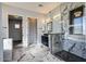 Spa-like bathroom with marble flooring and a large shower at 103 E Quartz Rock Rd, Phoenix, AZ 85085