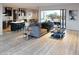 Open concept living space with modern furniture and access to a patio at 103 E Quartz Rock Rd, Phoenix, AZ 85085