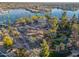 Aerial view of a park with a gazebo, walking paths, and waterfront views at 10632 W Roundelay Cir, Sun City, AZ 85351